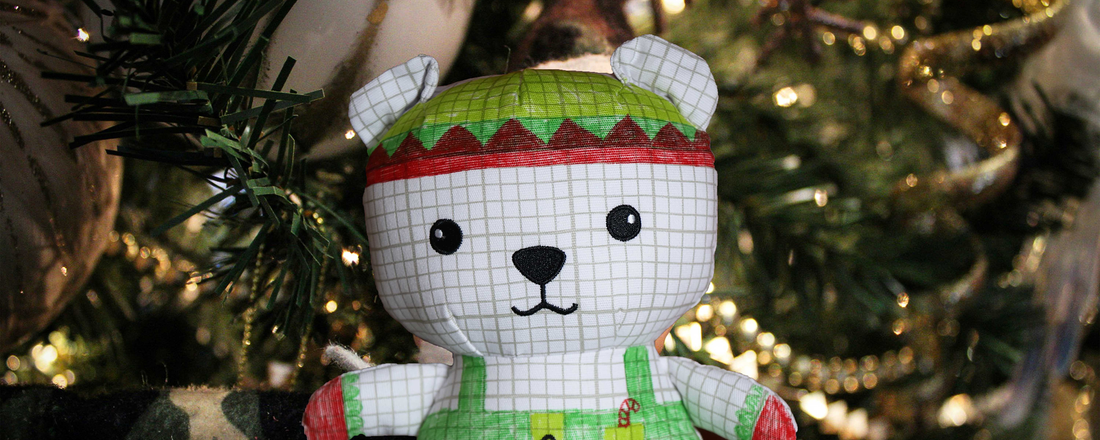 elfie bear in front of christmas tree