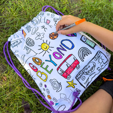 eatsleepdoodle collaborate with charity Go Beyond to create special new colour-in backpack