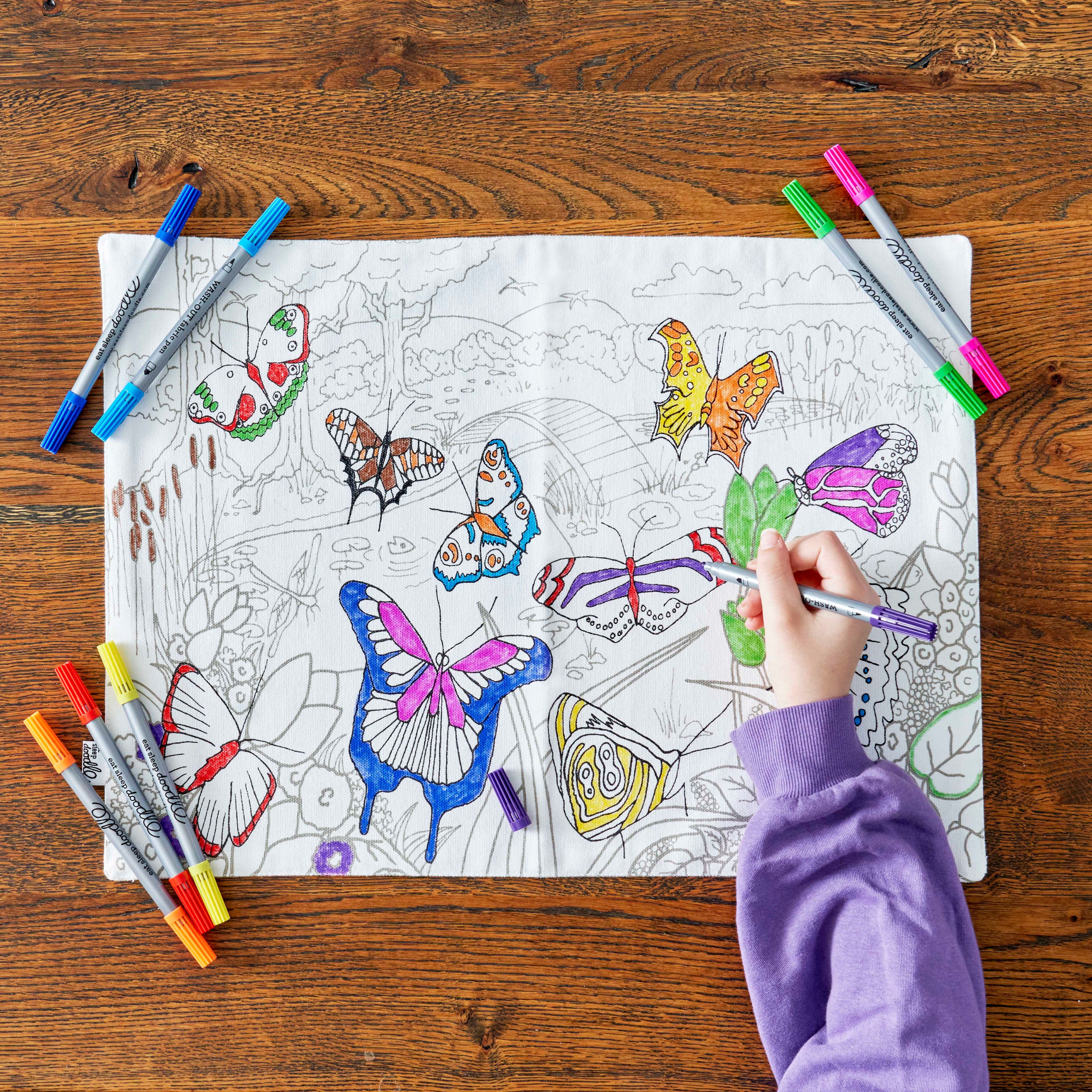 child colouring in butterflies