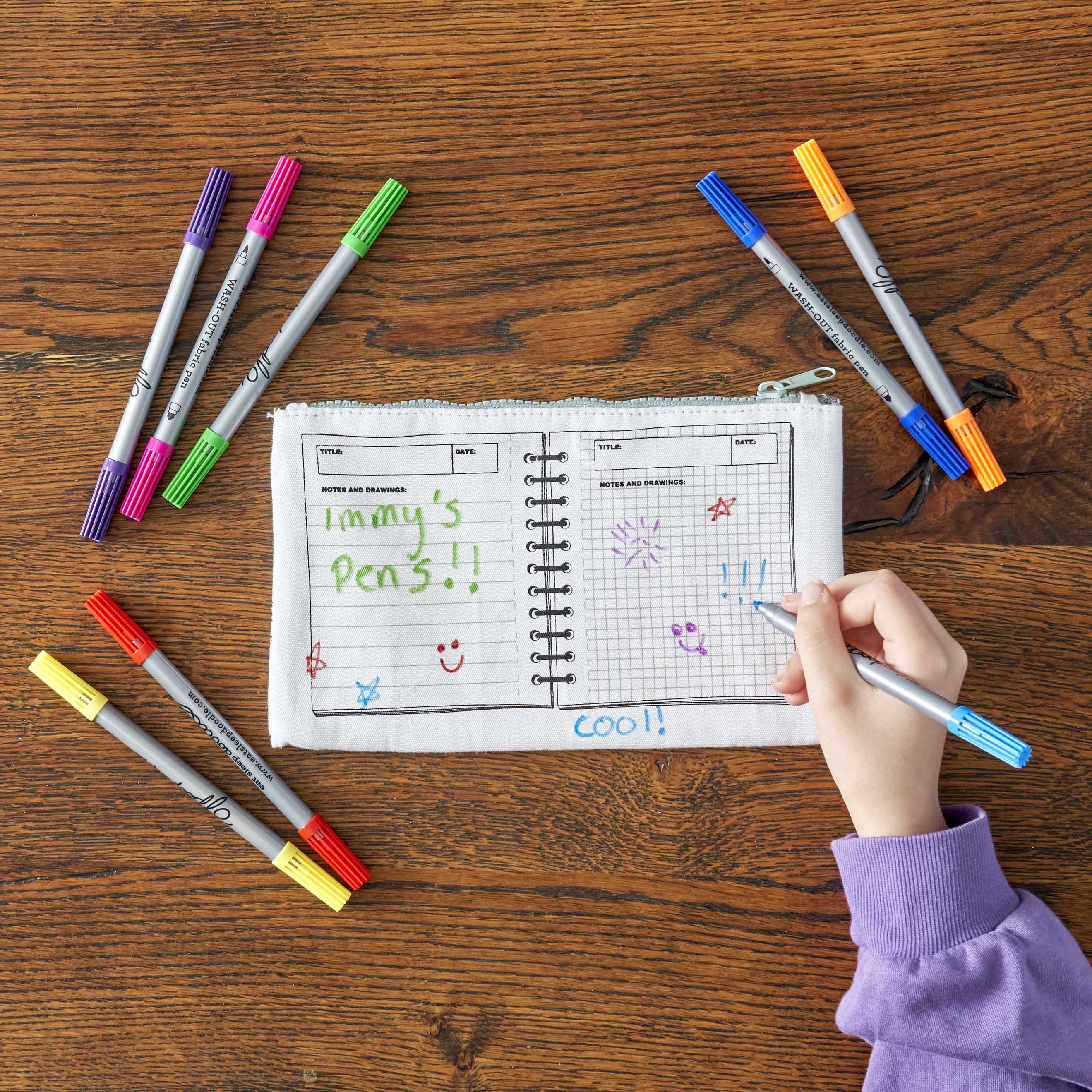 girl customising pencil case