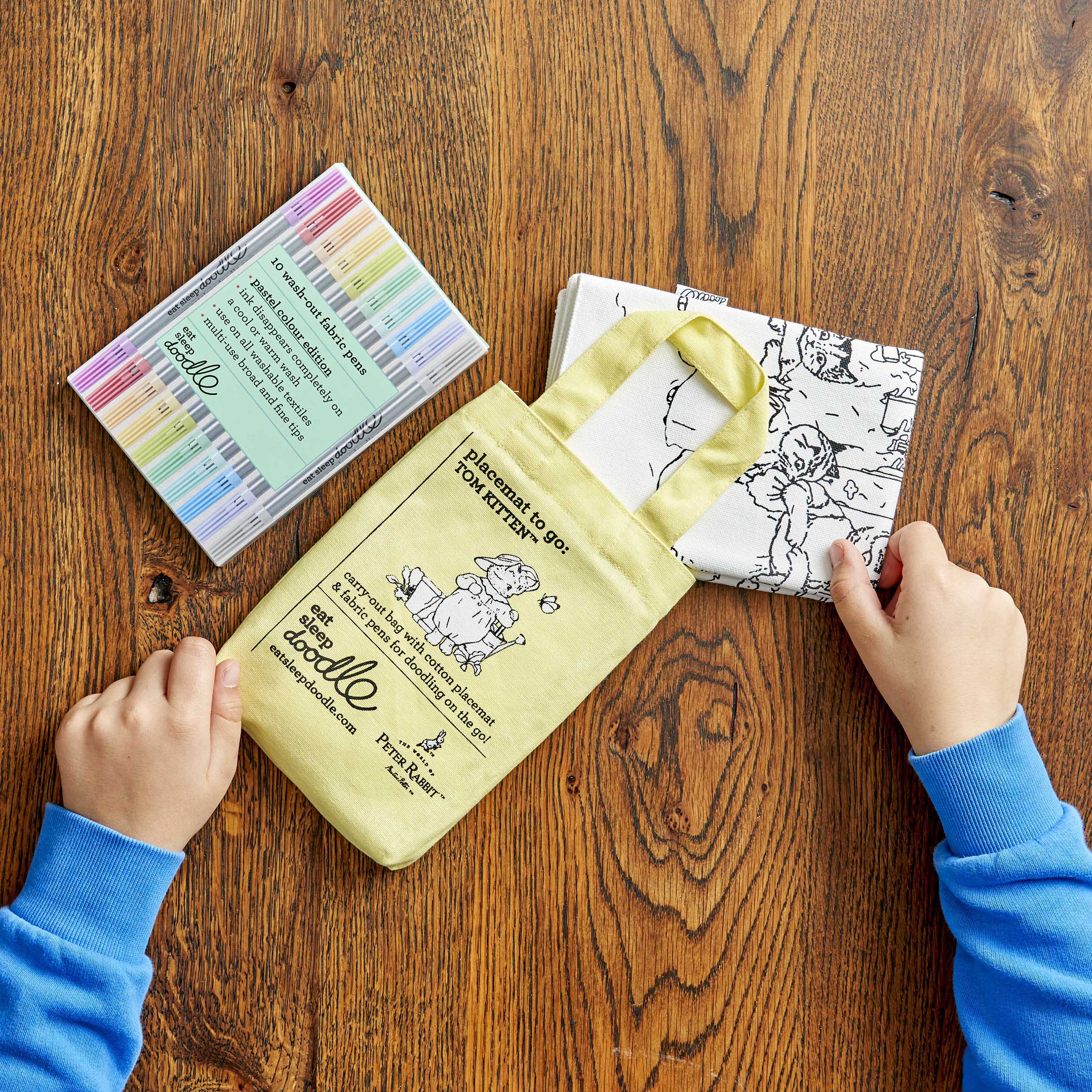 peter rabbit placemat folded and placed in yellow carry bag